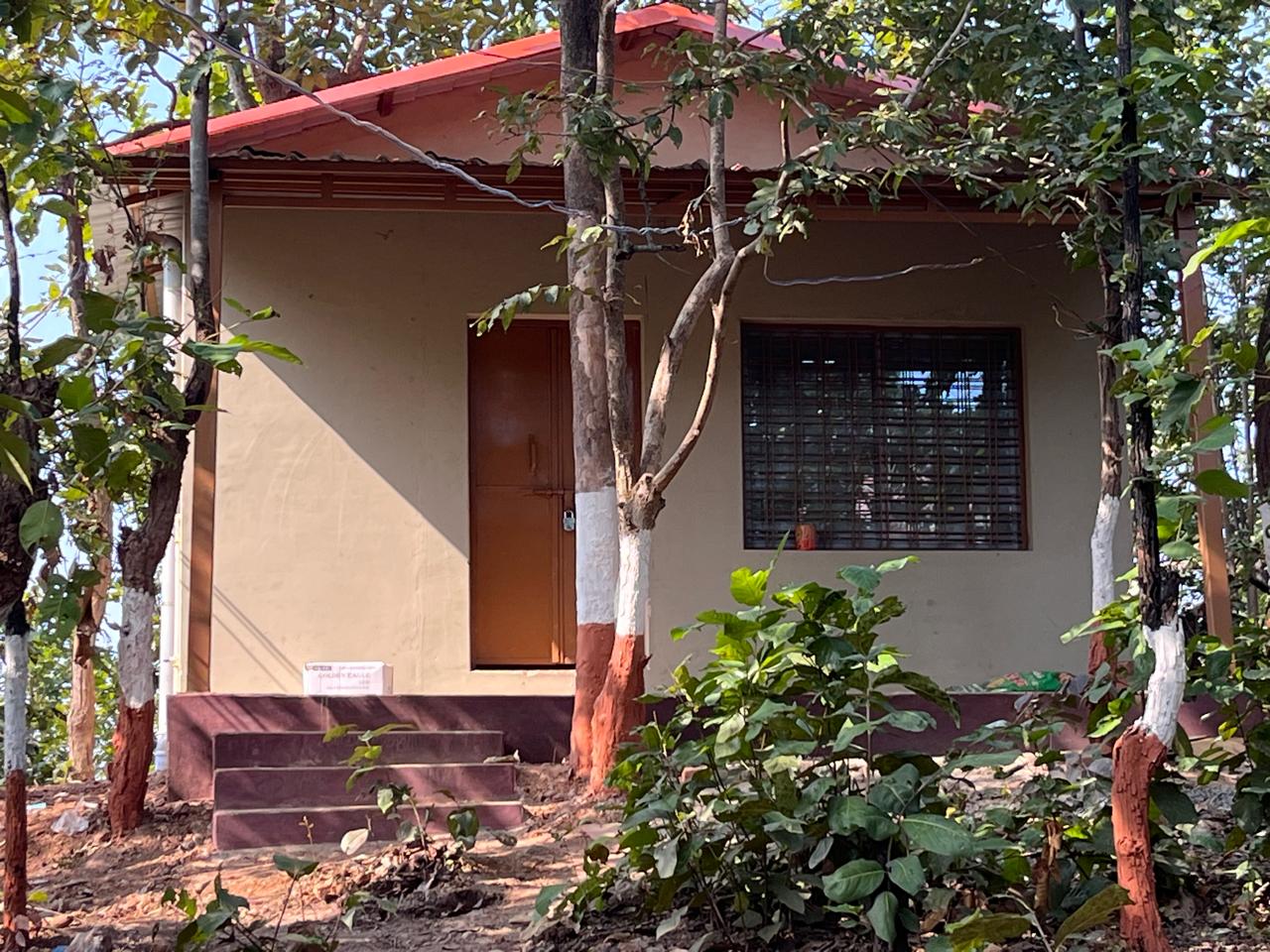 Luxury resort pool with palm trees at sunset